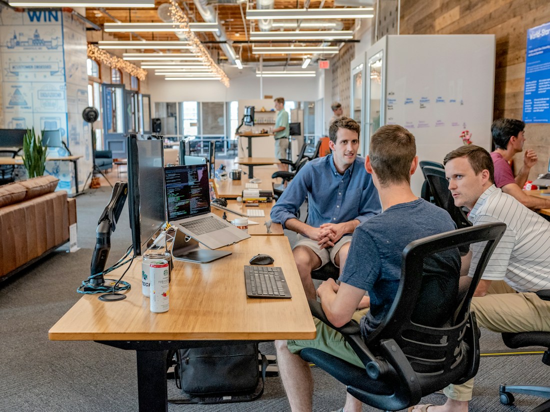 Operations team working together around a table